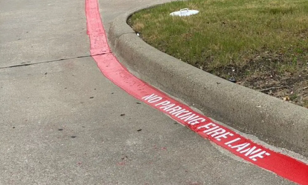 Fire lane and no parking pavement markings in a commercial lot