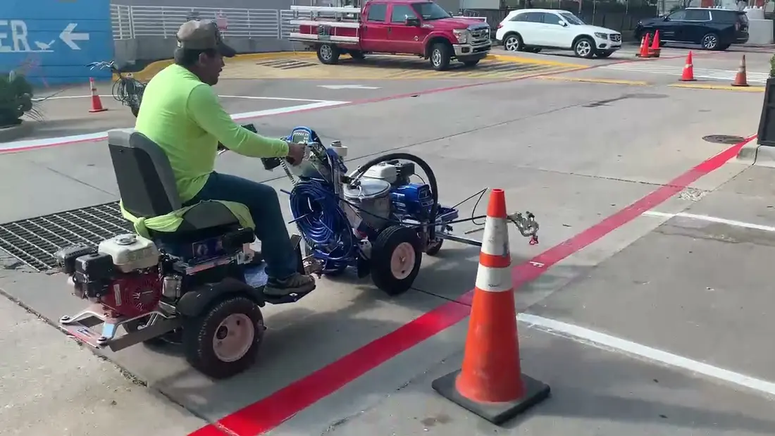 Parking lot restriping after faded pavement markings and winter wear